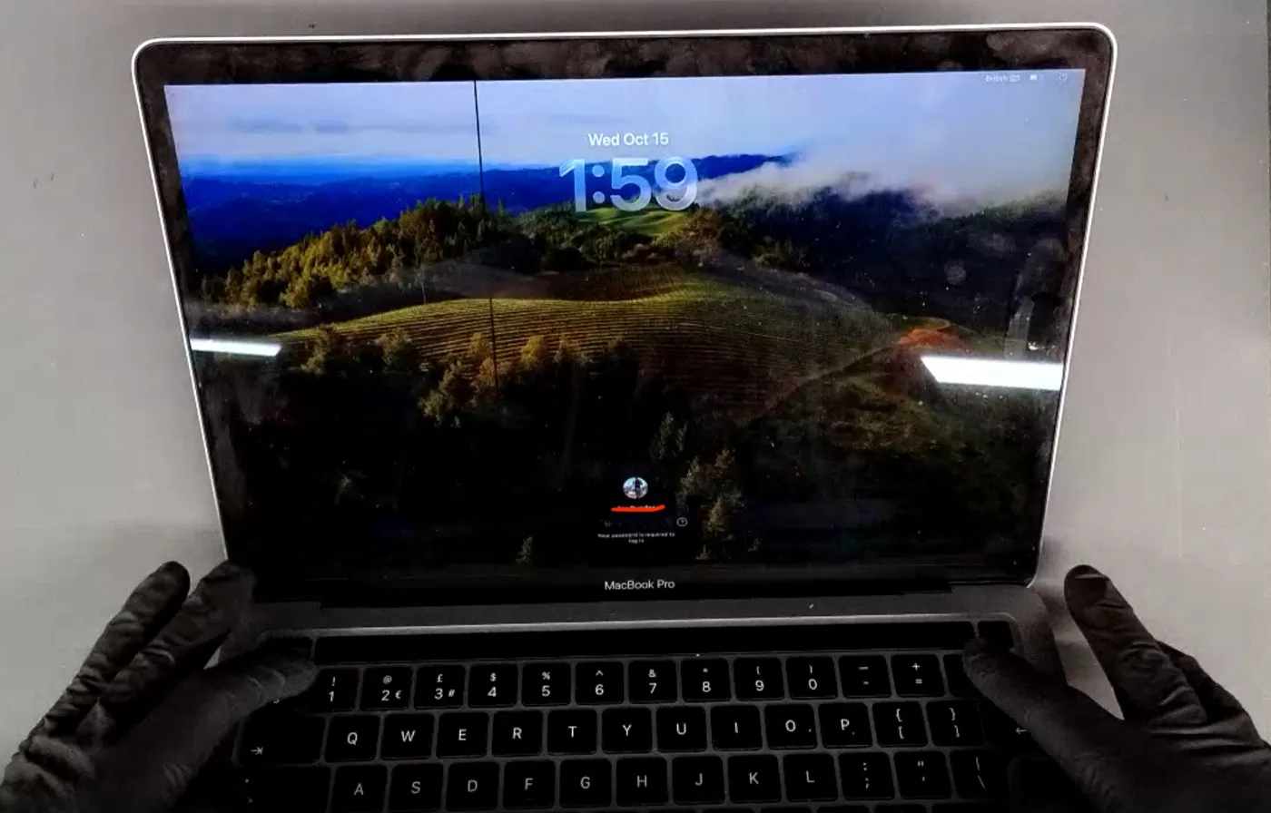 MacBook screen damage example — Faint vertical line, display still working