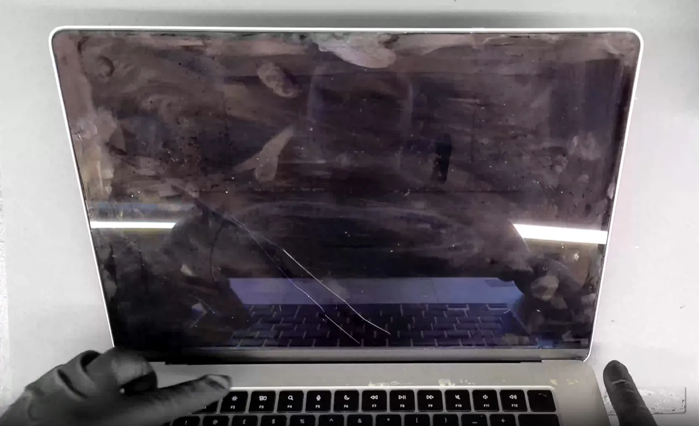 MacBook screen damage example — Dark, unresponsive panel from internal damage